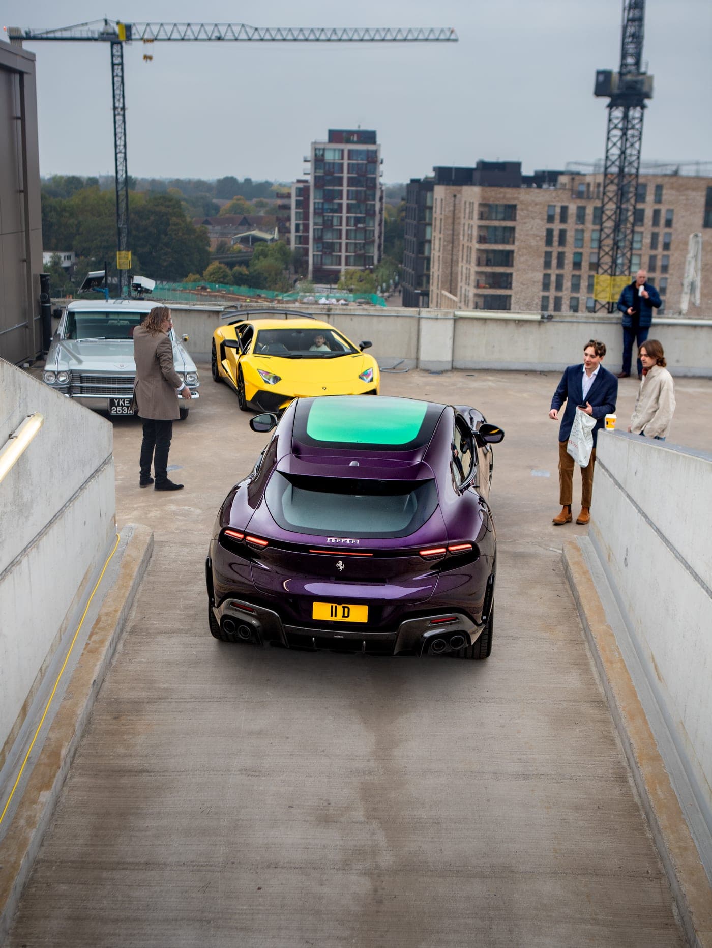 Private plate cars gathered at a rooftop event
